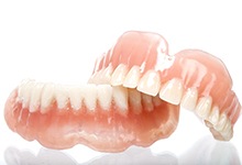 Pair of dentures resting on a table