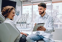 dentist discussing with a a patient 
